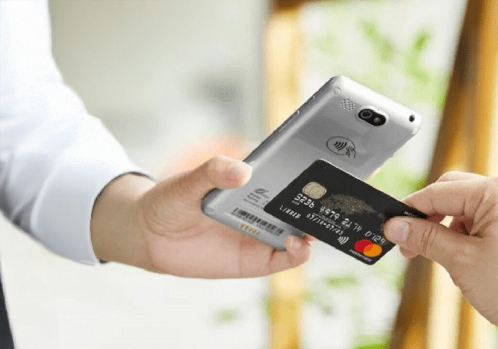 Retail business owner processing contactless payment in real-world case studies example