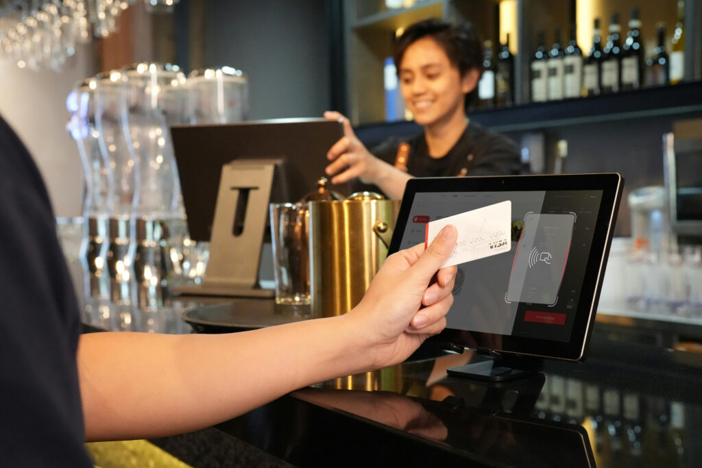 Retail merchant services comparison showing contactless payment on integrated EPOS system